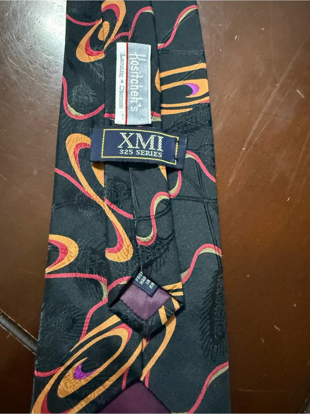 Black Tie with Orange and Pink Orbital Pattern